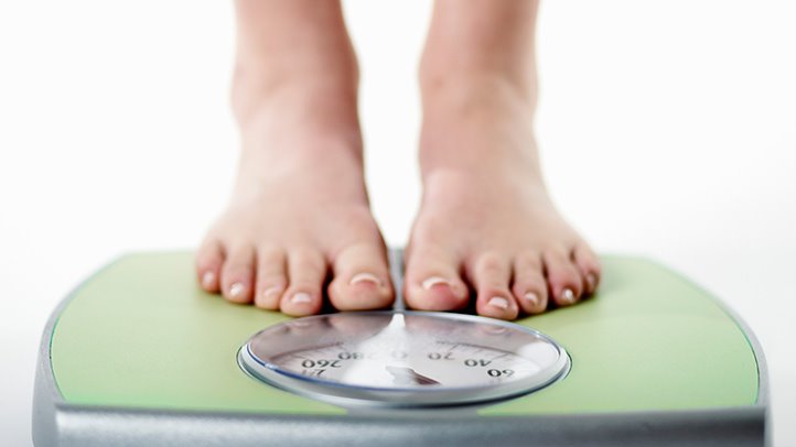 weight.loss-woman.on.scales